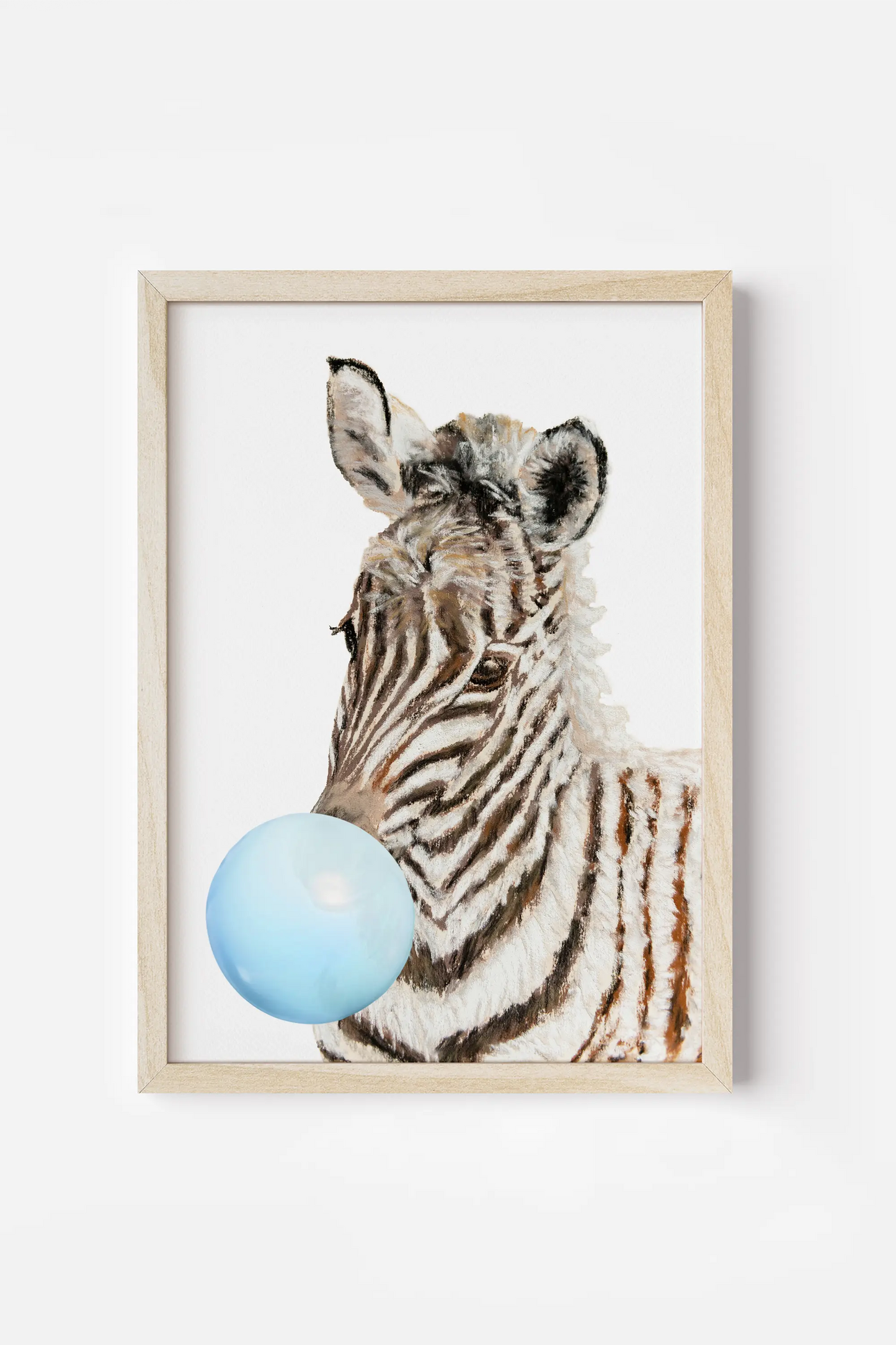 a picture of a zebra with a blue ball in it's mouth