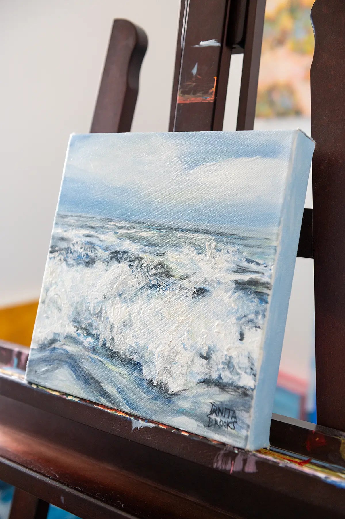 Side view of "Alive" painting showing expressive wave movement and textured brushwork