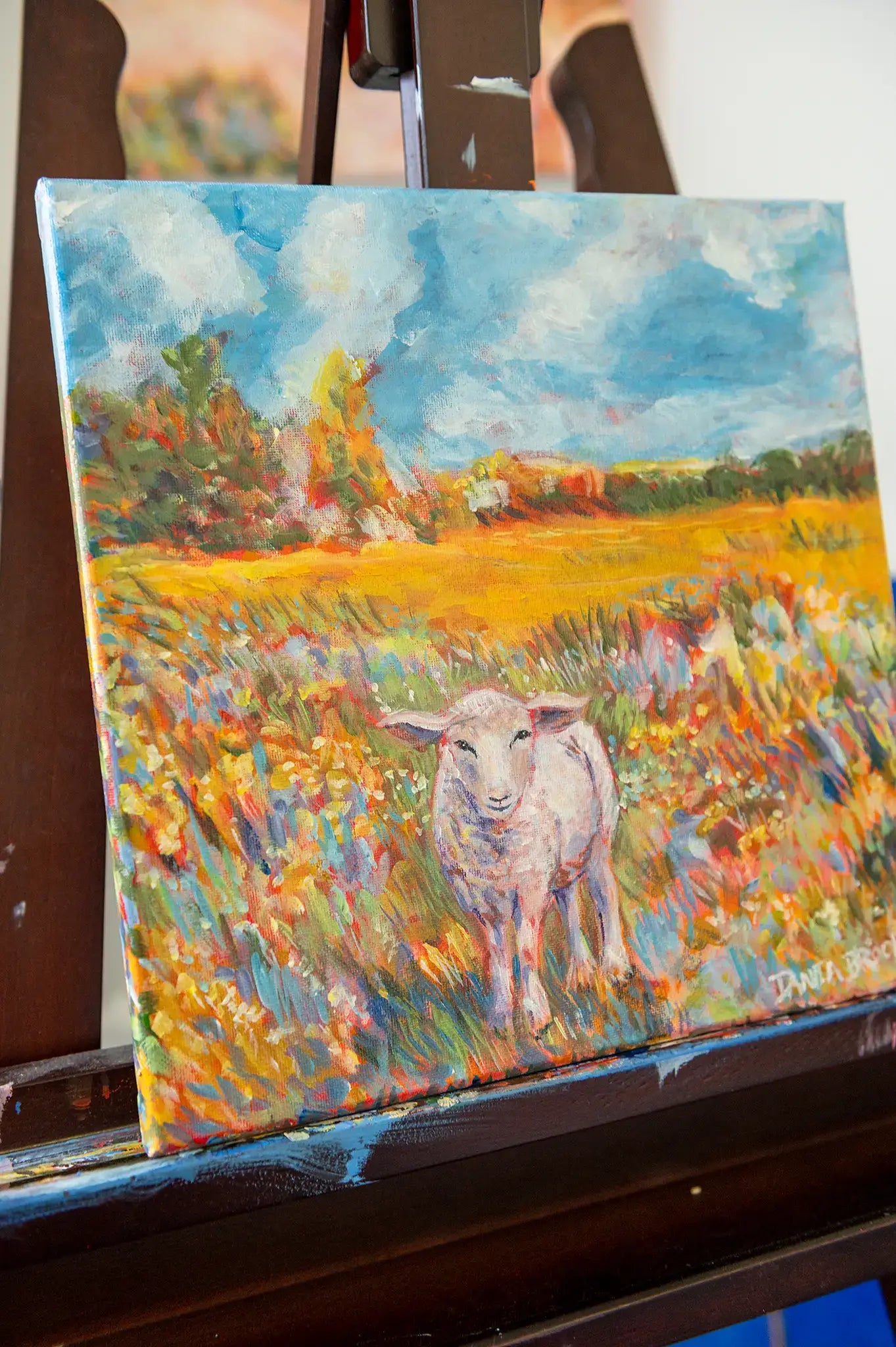 Side angle of “Beloved” lamb painting showing brushstrokes and depth of canvas