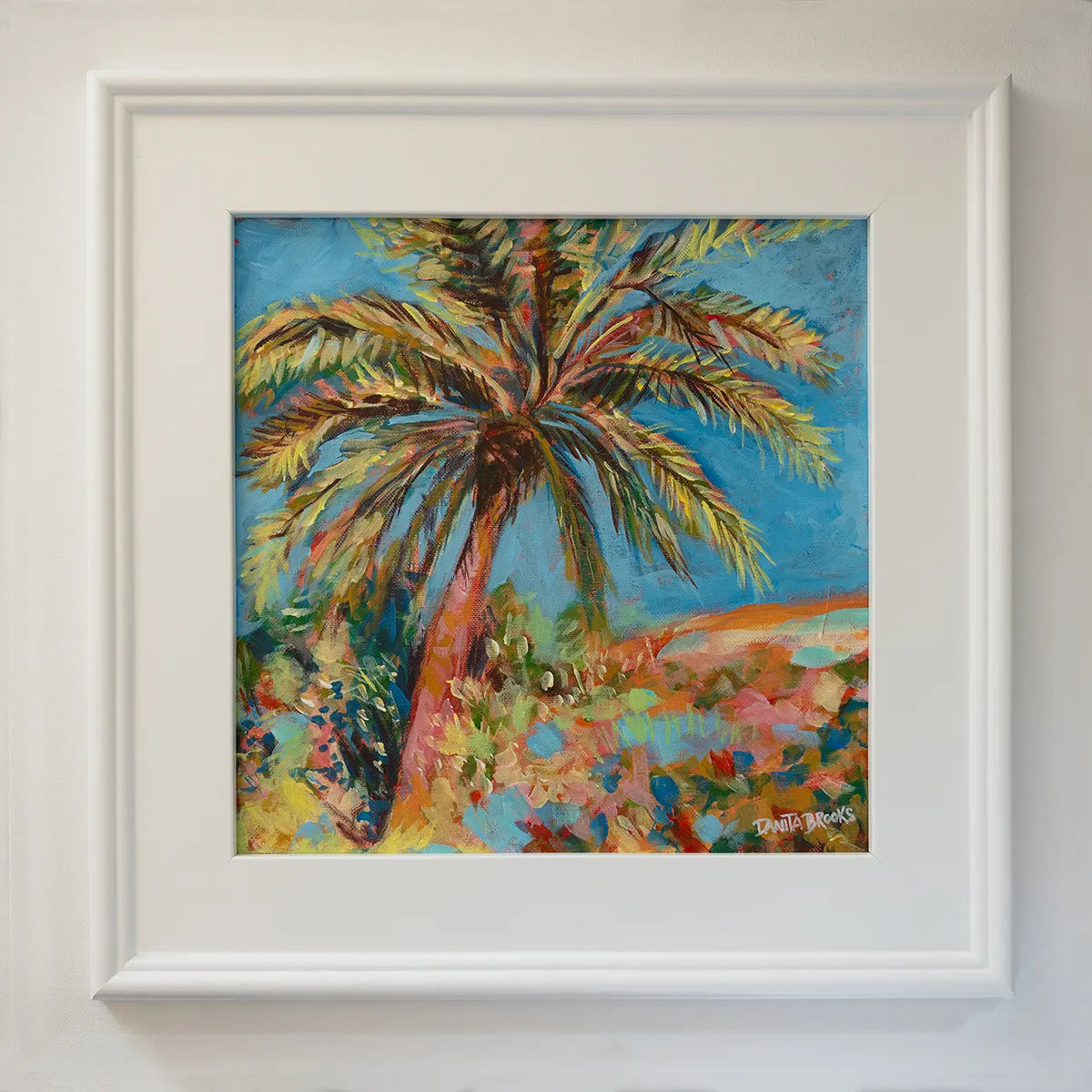 Original palm tree and sky painting titled "Clear Skies Ahead" by Danita Brooks, framed in white plein air frame and displayed in natural light