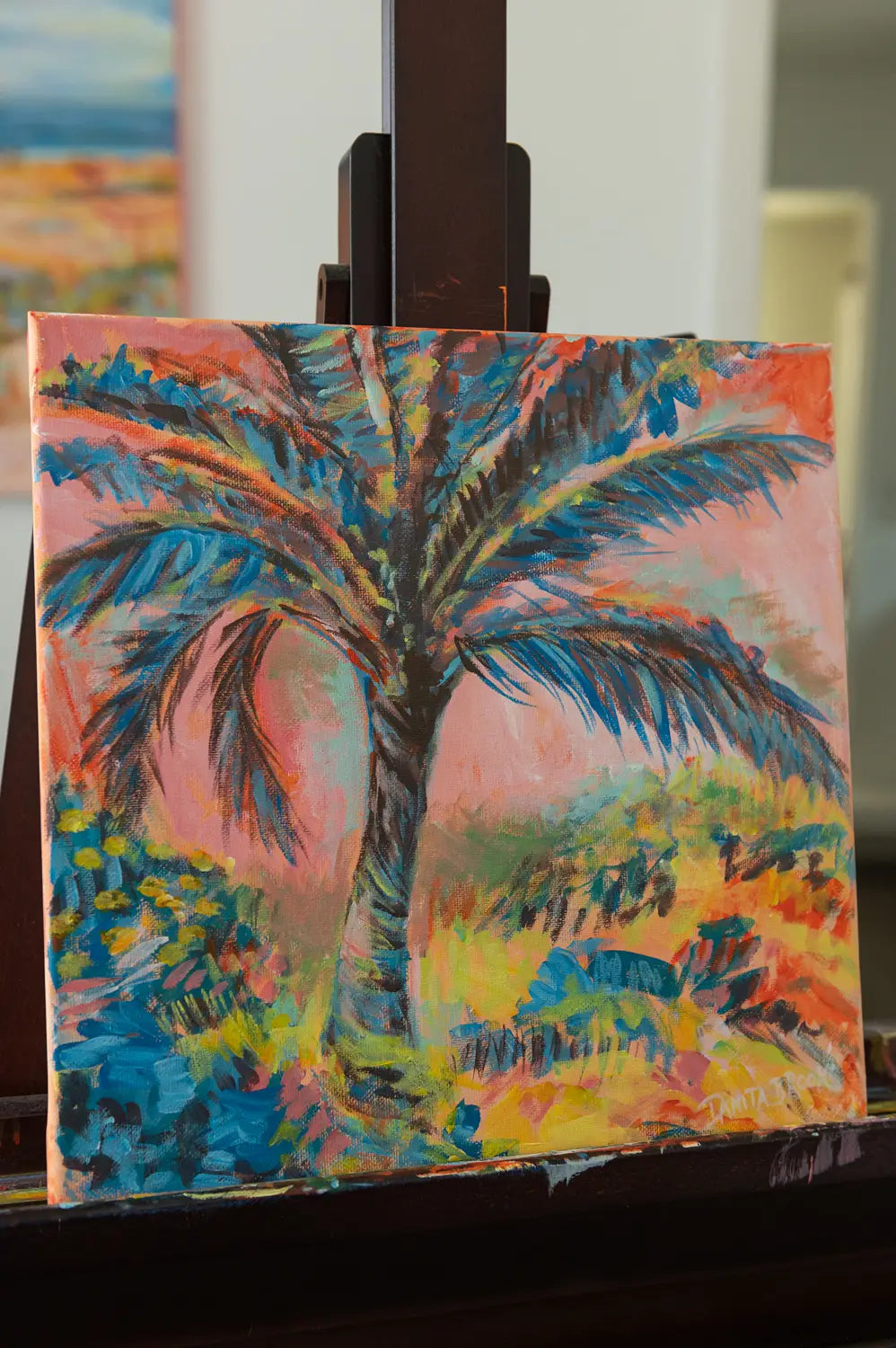 Coastal painting "Cotton Candy Skies" by Danita Brooks, angled to show brush texture and dreamy sunset tones