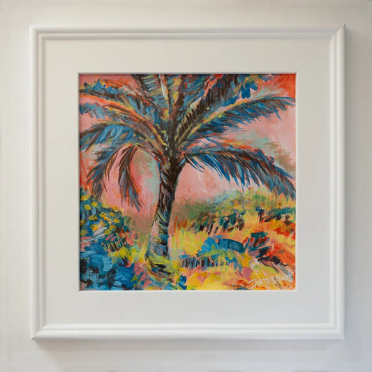 Original palm tree painting titled "Cotton Candy Skies" by Danita Brooks, framed in white plein air frame and displayed in soft natural light