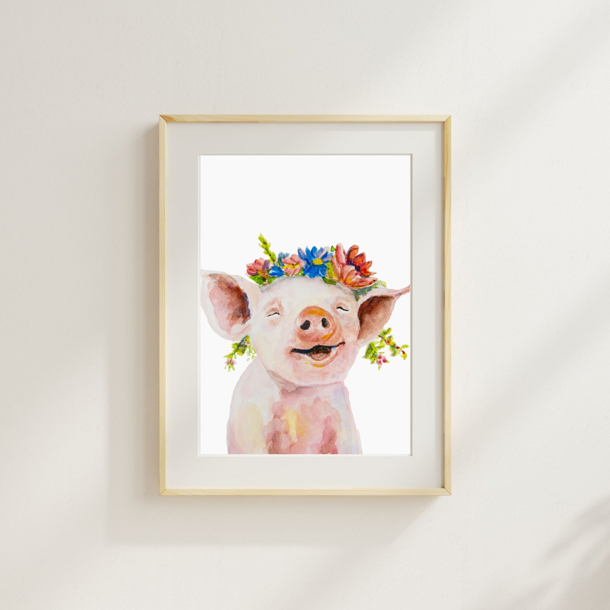 Farm nursery art print with watercolor pig print shown here in a frame with a mat – whimsical flower crown animal wall art