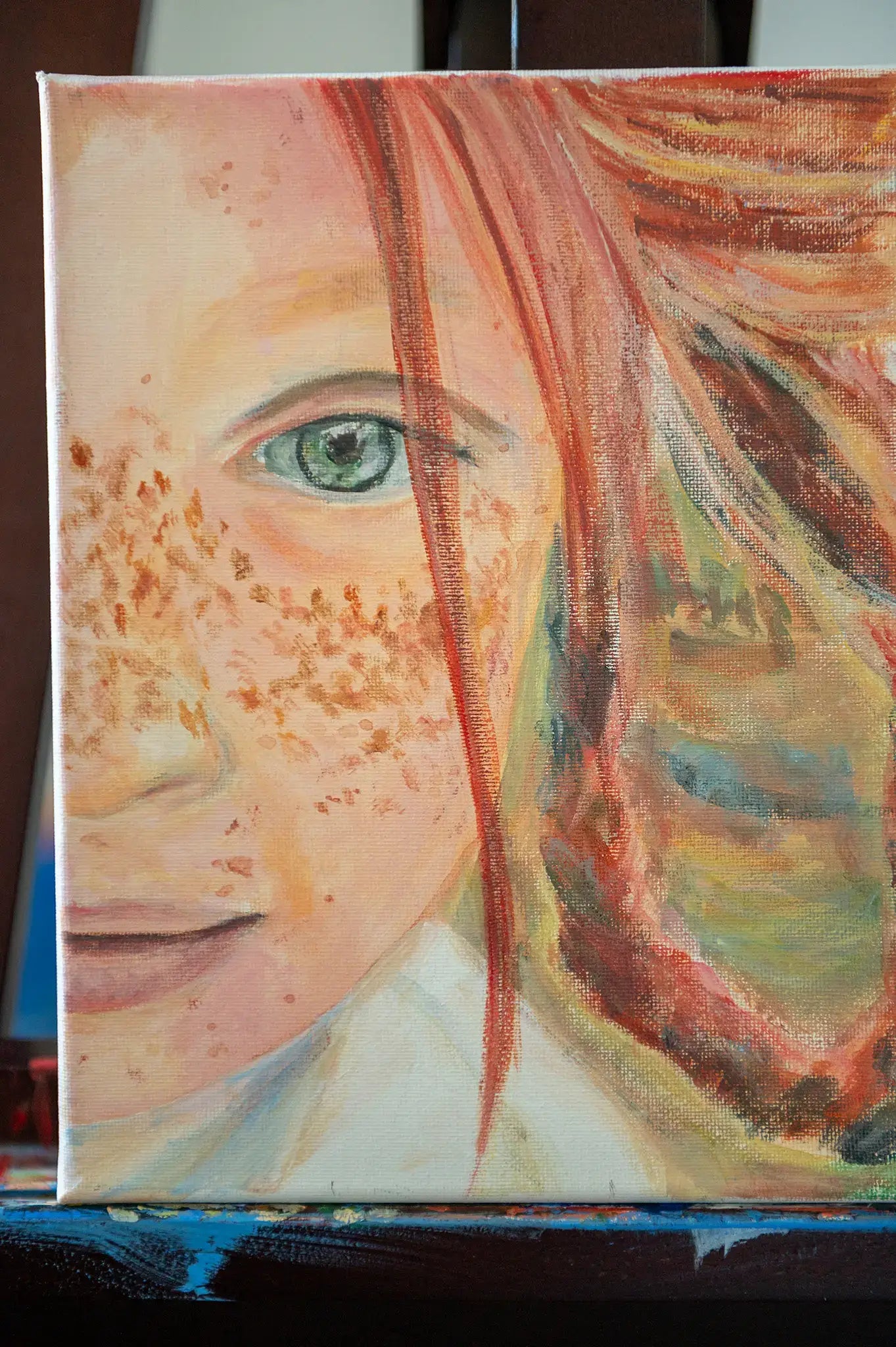 Close-up of freckled cheek and eye in “Freckles” original painting by Danita Brooks