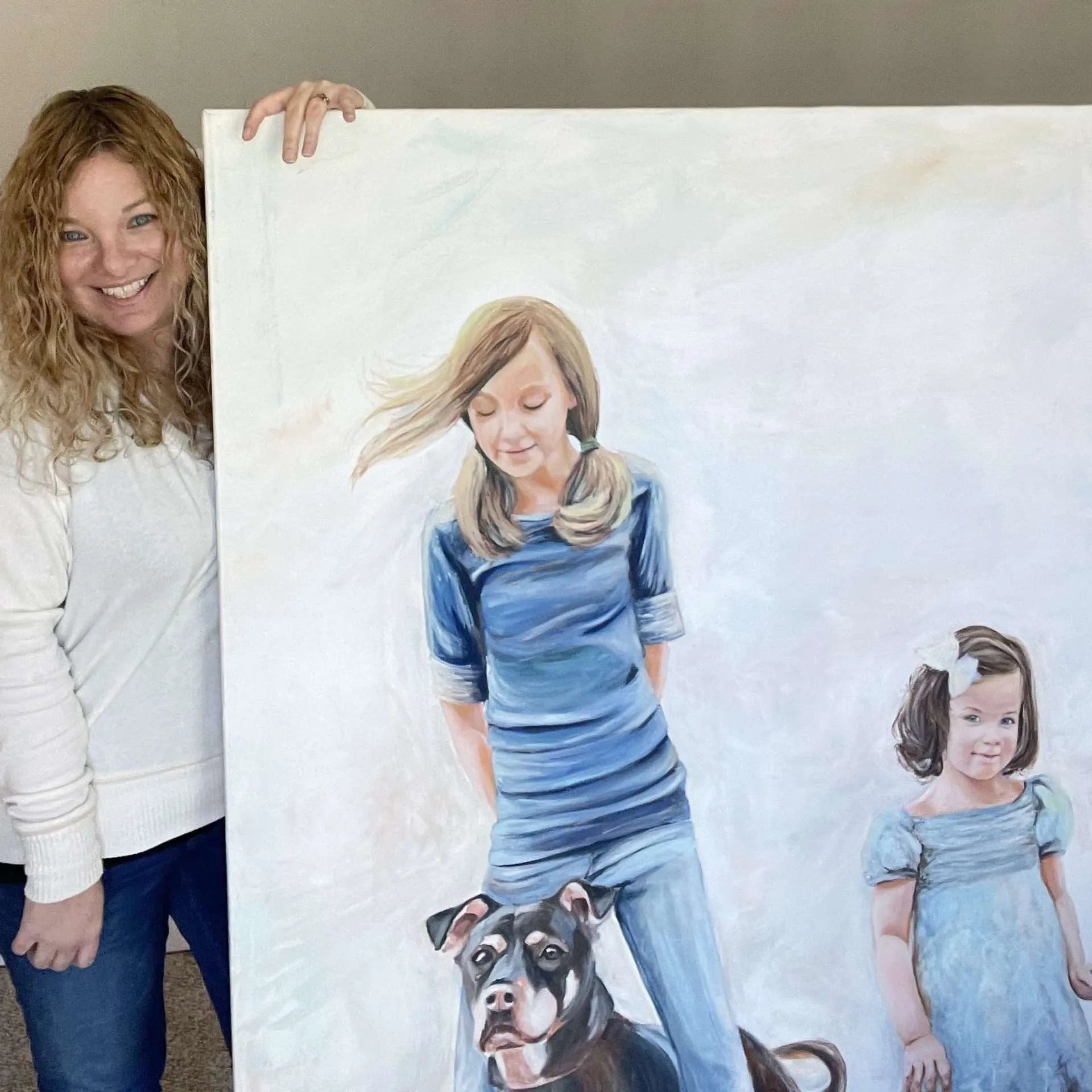 Seascape painter Danita in her studio also began as a children's portrait painter and loves to work on big canvases with candid reference images.