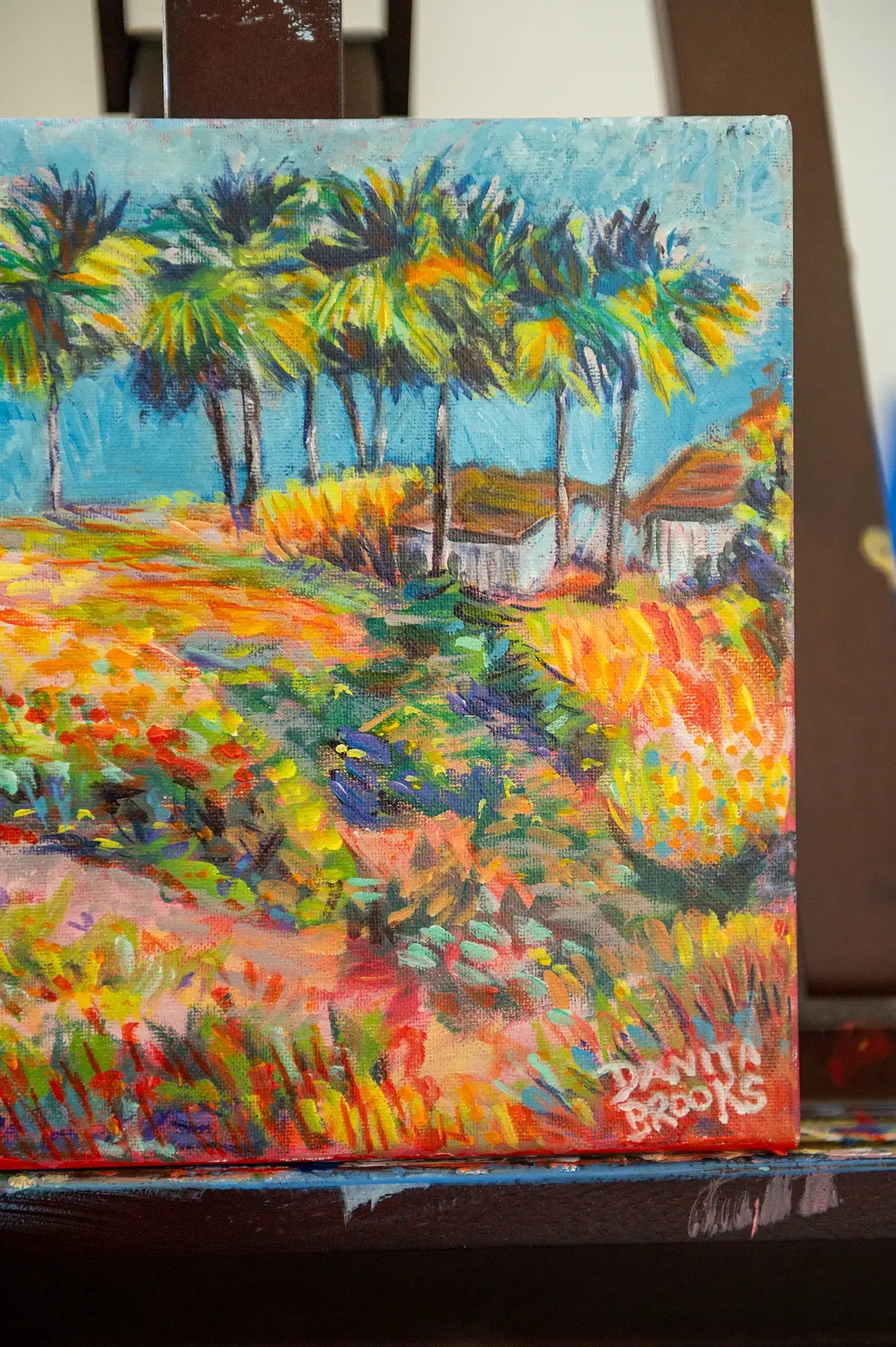 Signature detail in lower corner of “Where the Palms Grow” original painting