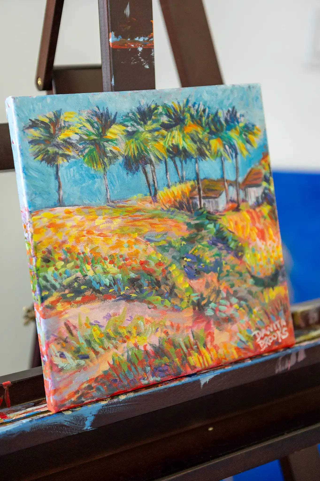 Side view of “Where the Palms Grow” painting, showing canvas edge and brush texture