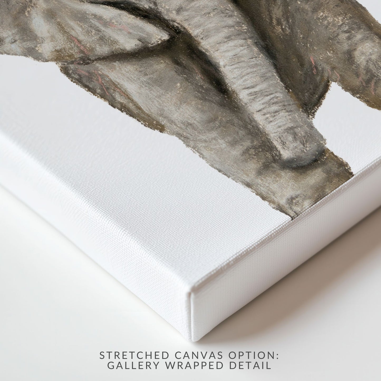 Close-up of a stretched canvas corner with a textured wall background