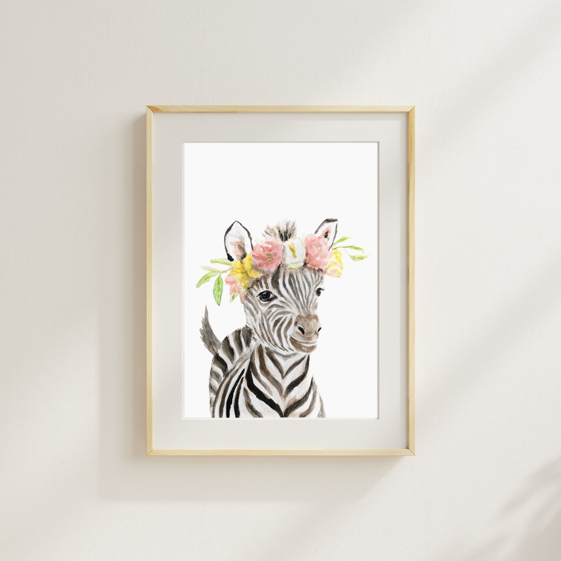 Zebra with wildflower crown watercolor print matted and framed on wall in safari-themed nursery