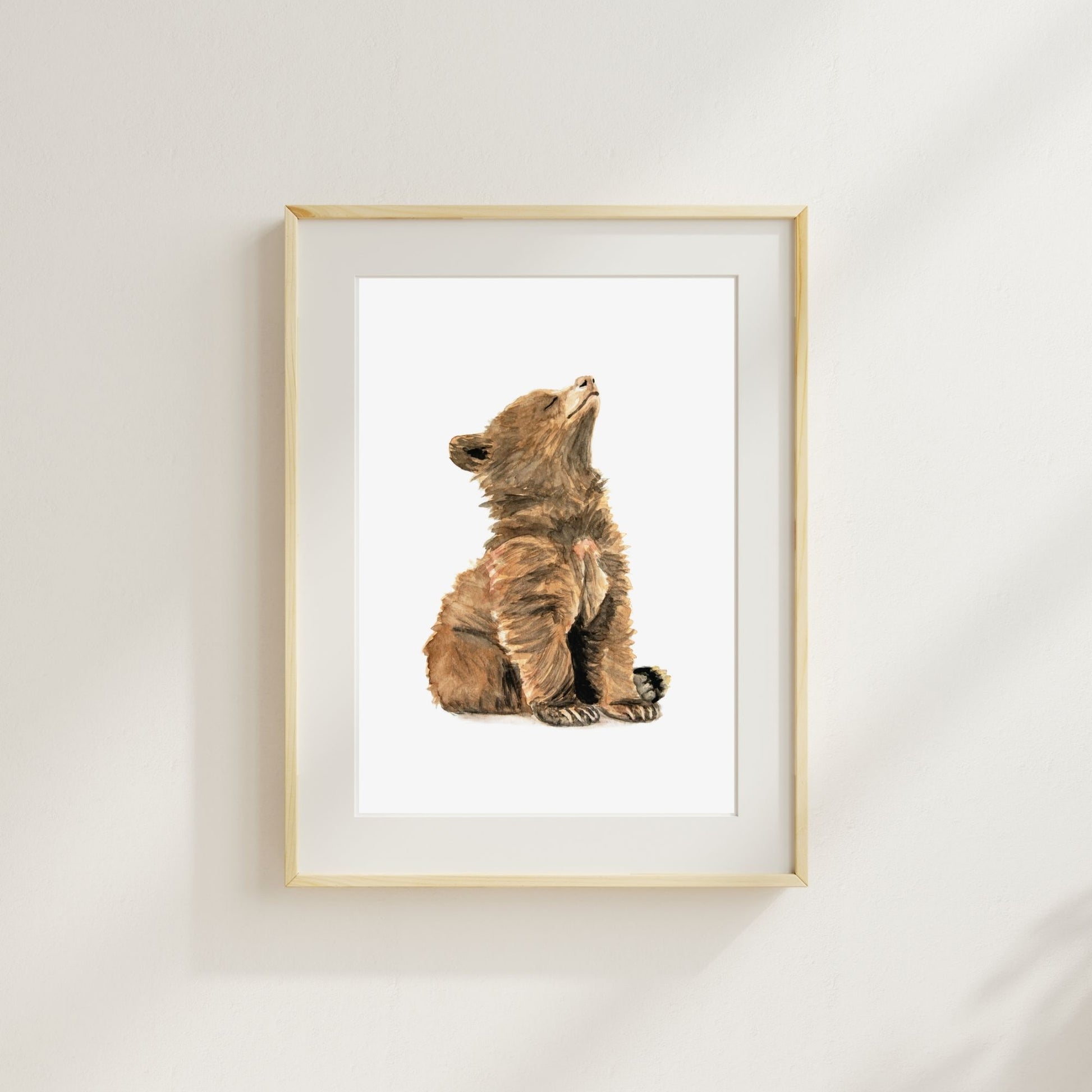 Woodland nursery baby bear art print – forest animal wall art styled in a wood frame with a mat