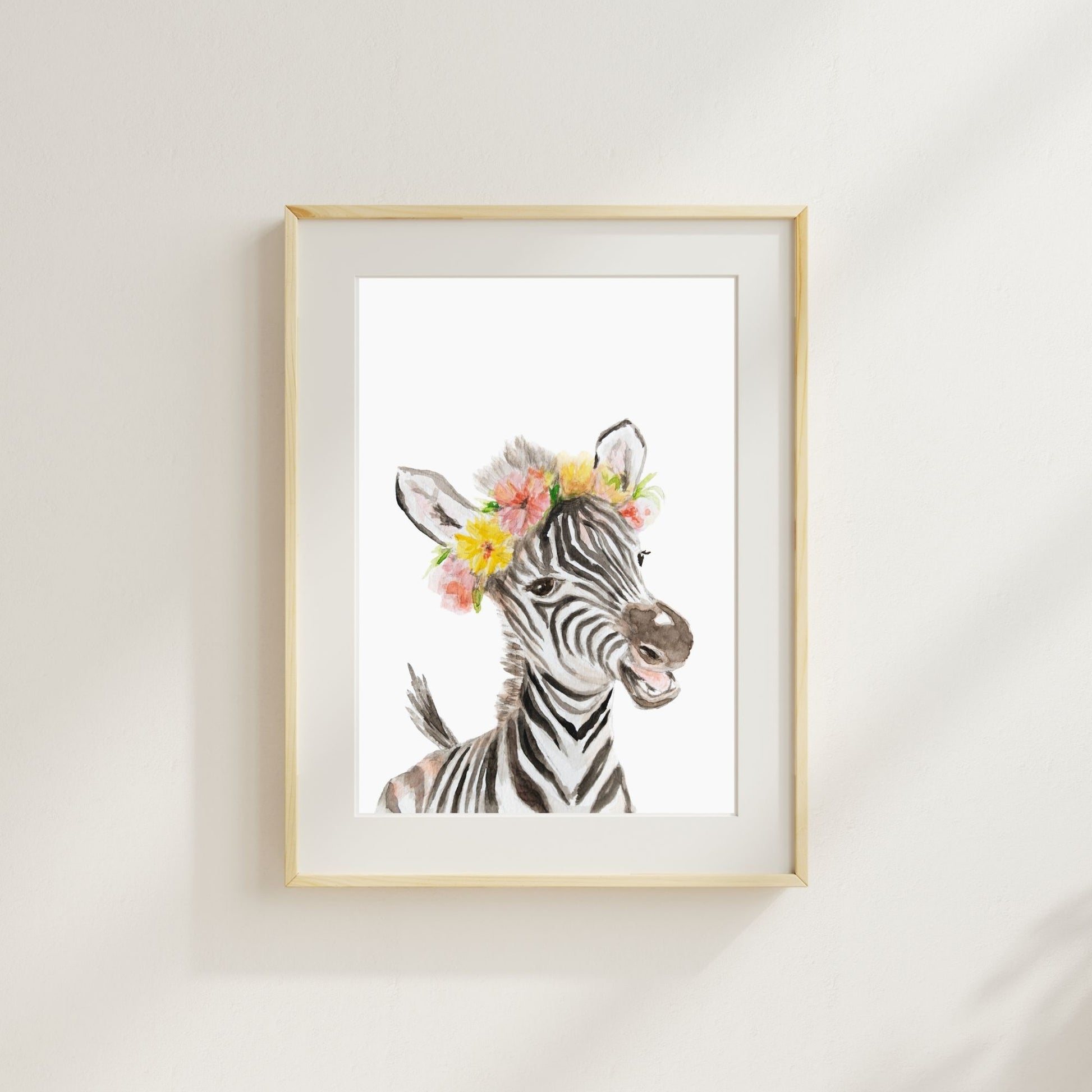 Zebra with tropical flower crown watercolor print matted and framed on wall in safari-themed nursery