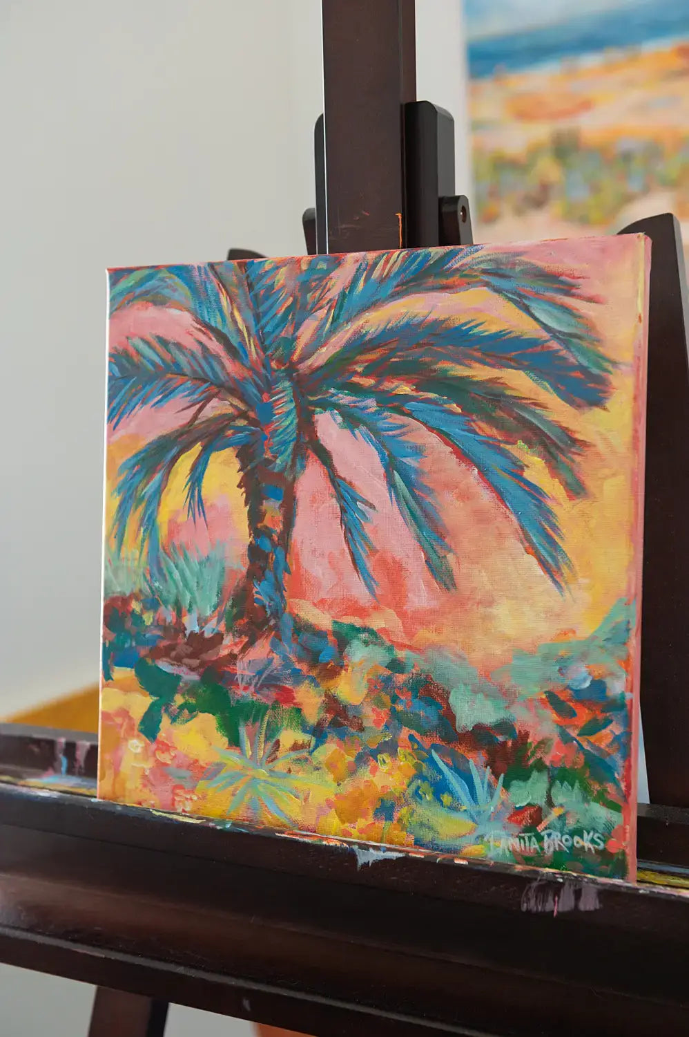 Tropical wall art "Everlasting Sunset" by Danita Brooks, angled to highlight the warm tones and texture of the acrylic brushwork