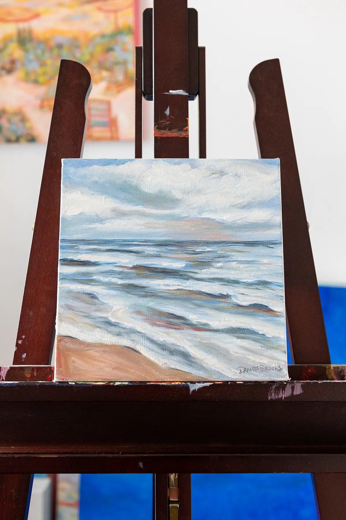 Original oil painting titled "Turning Point" by Danita Brooks, displayed on an easel in natural light