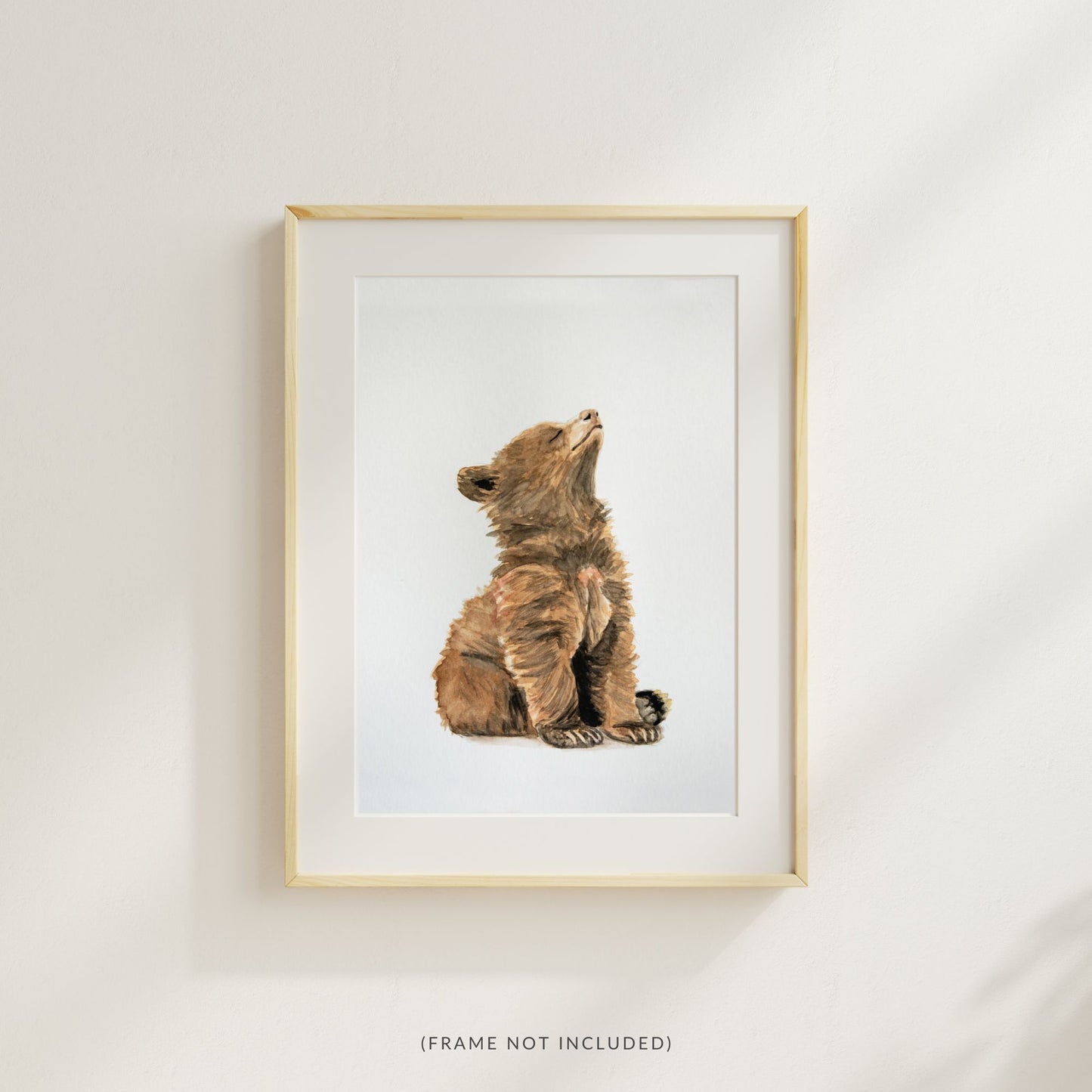 Woodland nursery baby bear art print – forest animal wall art styled in a wood frame with a mat