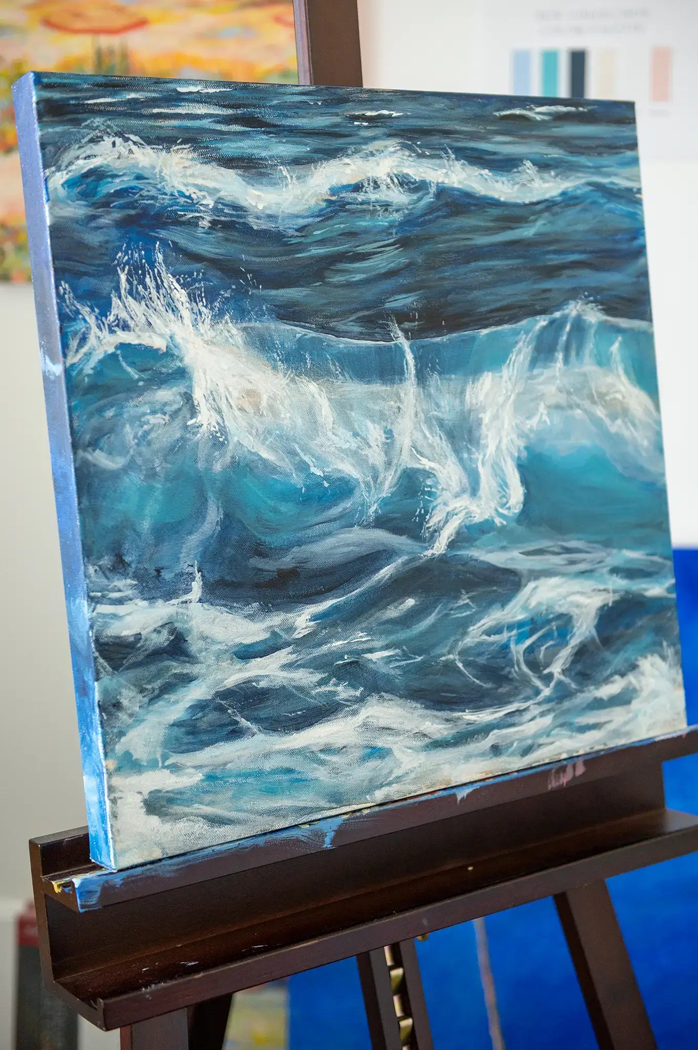 Side view of "Nanosecond" acrylic wave painting showing movement and layered brushwork in the sea