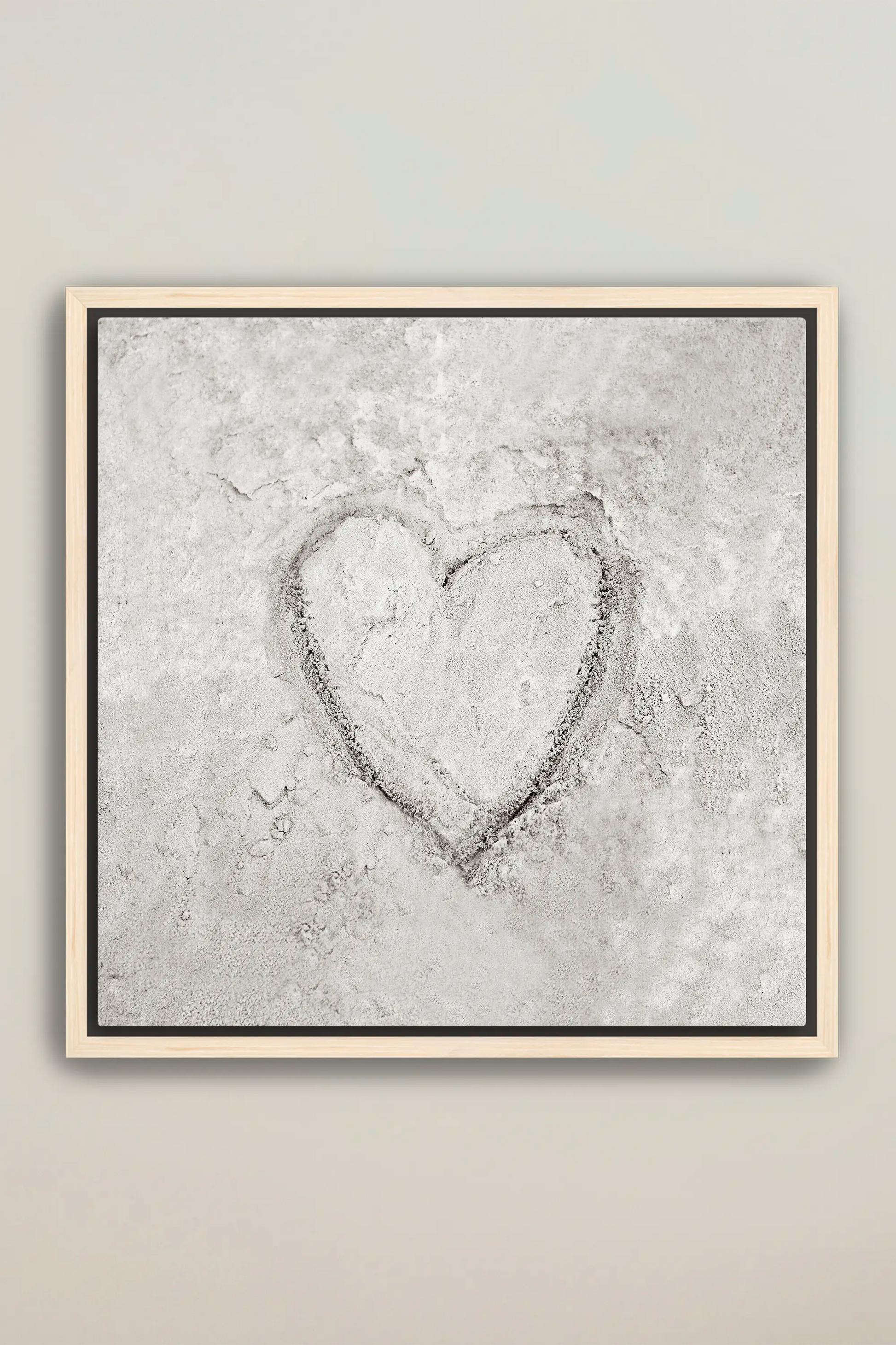 a picture of a heart drawn in the sand