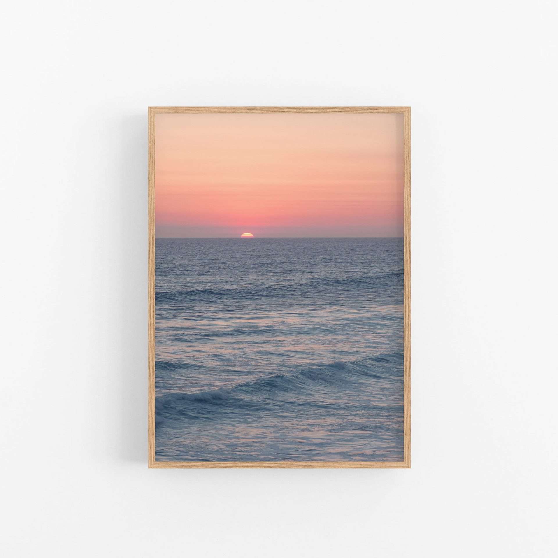 a picture of a sunset over the ocean