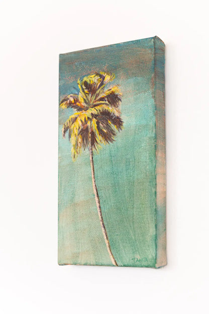 Angled view of "The Long Way Home" palm tree painting hanging on a white wall, showing the right canvas edge and golden palm fronds.