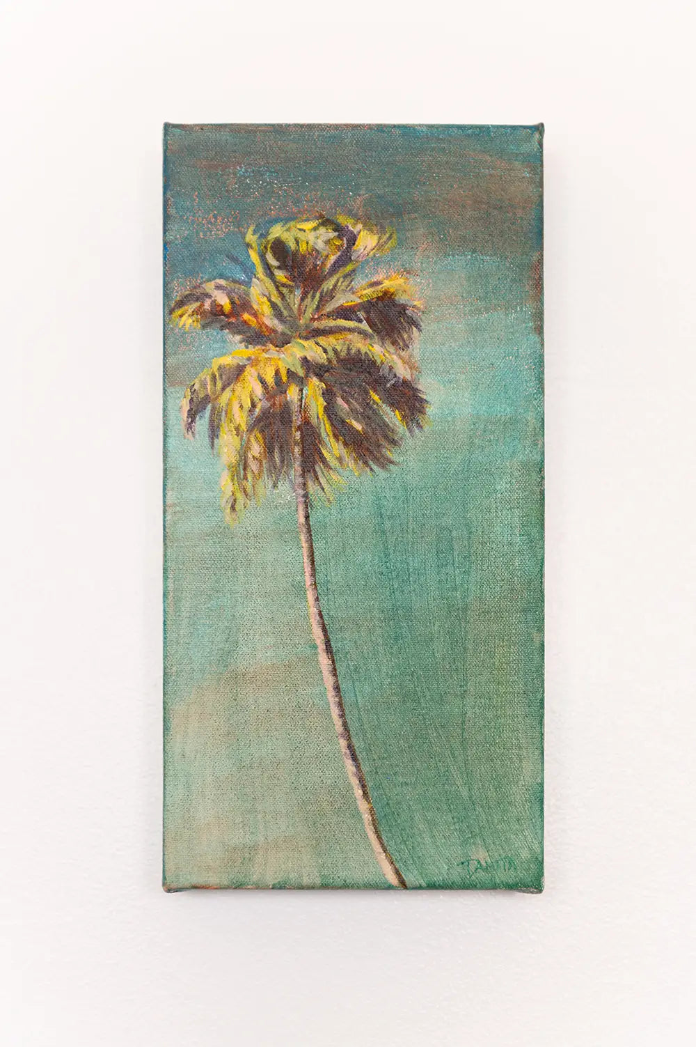 Front view of "The Long Way Home" palm tree painting on a white wall, a tall, narrow painting of a sunlit palm against shades of turquoise and soft green.