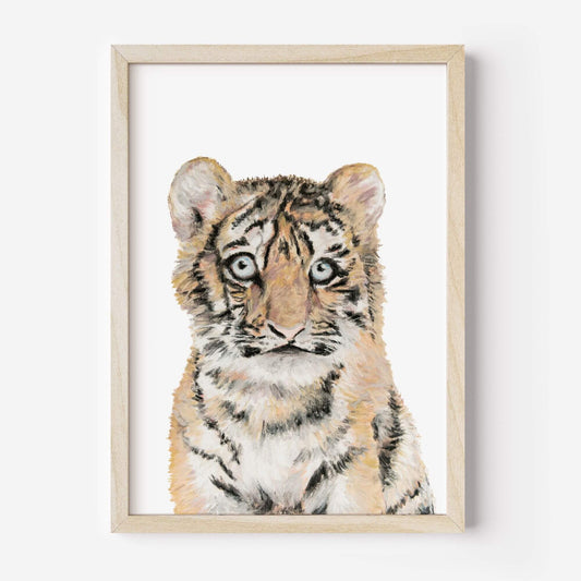 Framed artwork of a tiger cub on a white background