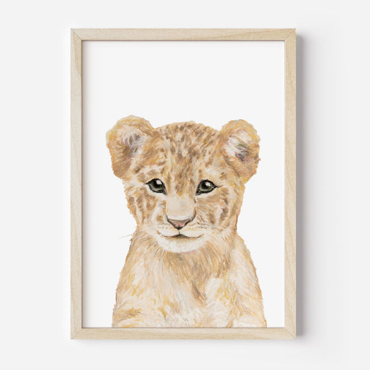 Framed artwork of a lion cub on a white background