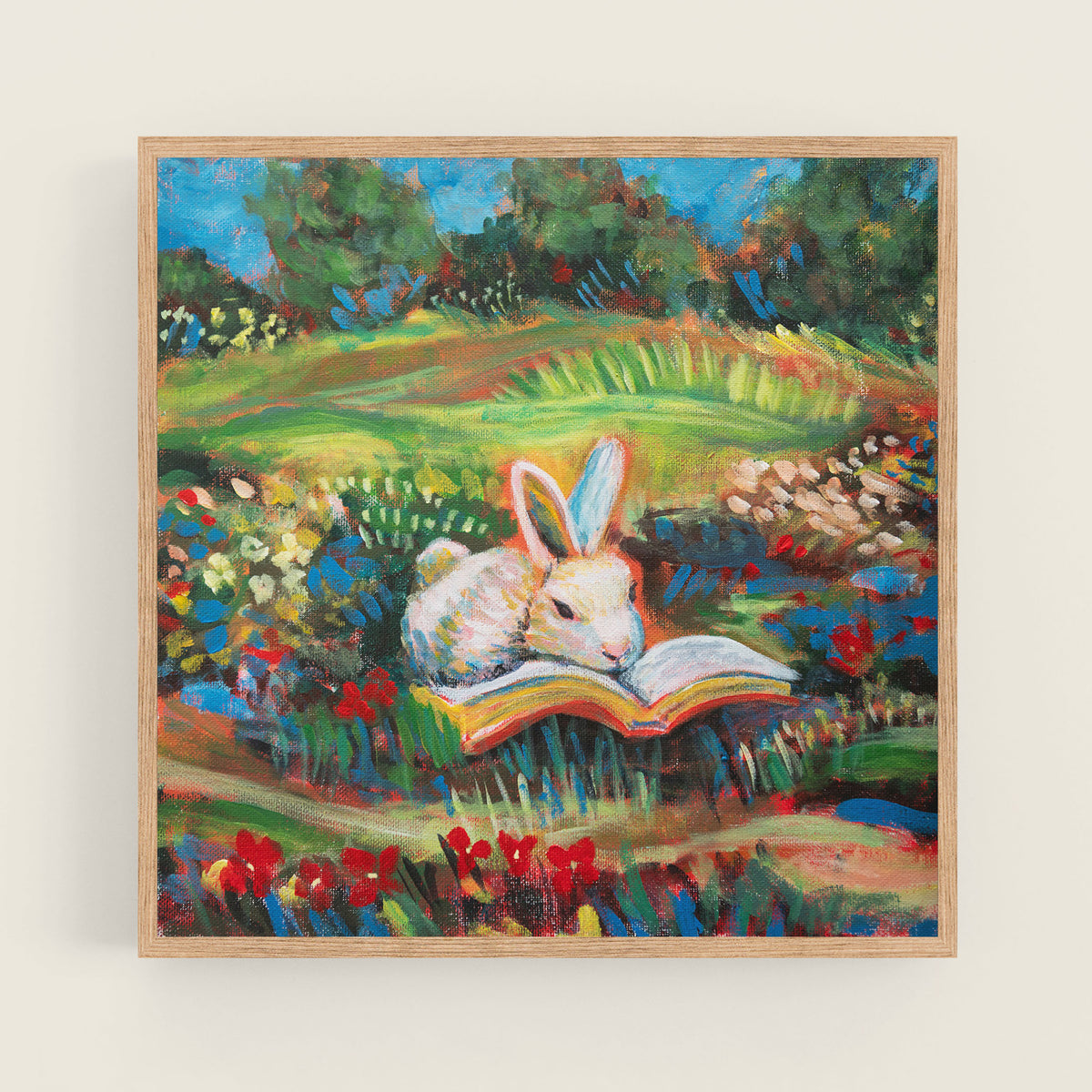 "Petals and Pages" square art print by Danita Brooks, a bunny reading a book among wildflowers