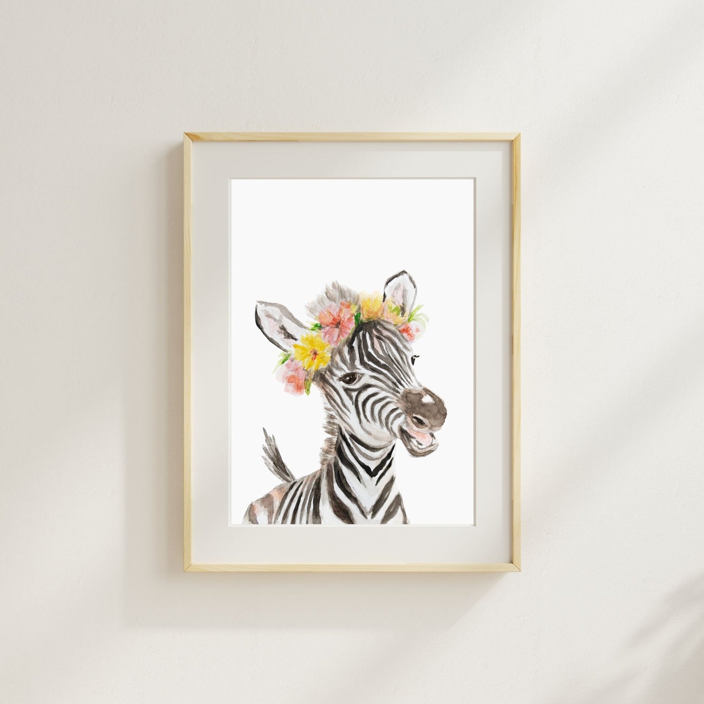 Zebra with tropical flower crown watercolor print matted and framed on wall in safari-themed nursery