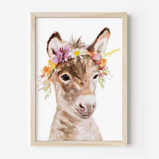 Framed artwork of a donkey with a floral headband on a white background