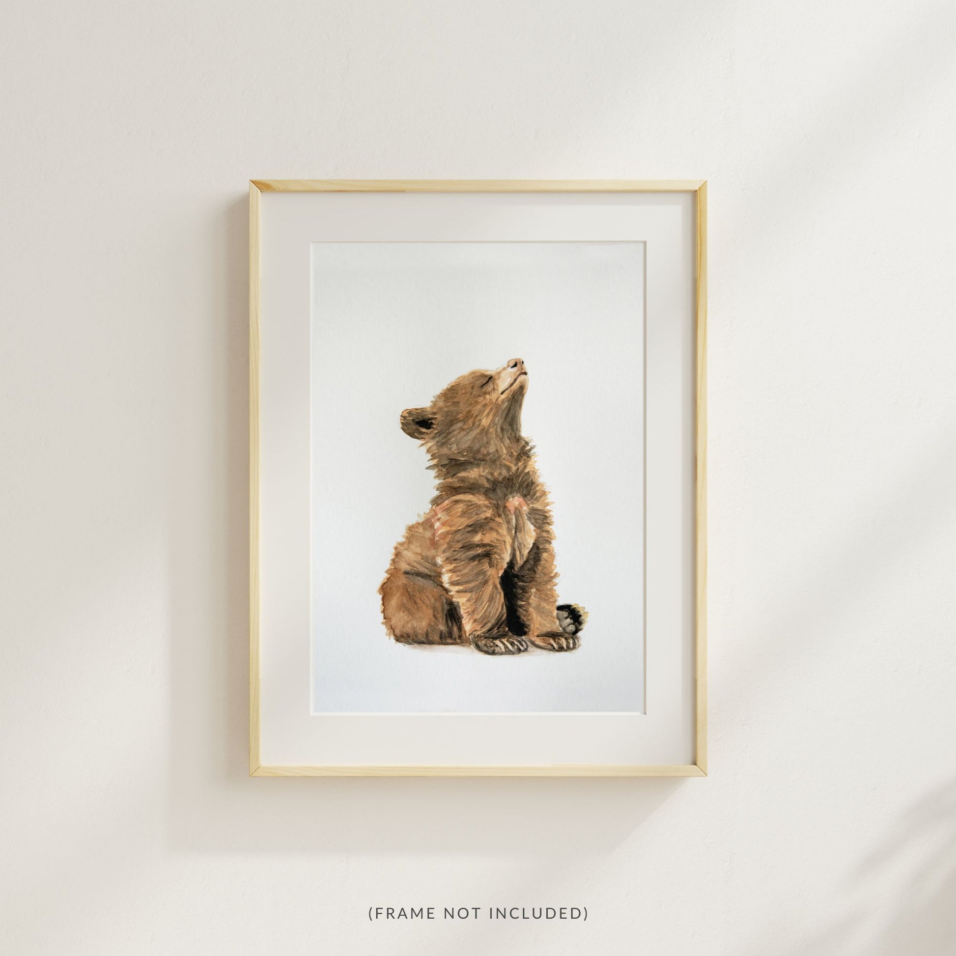 Woodland nursery baby bear art print – forest animal wall art styled in a wood frame with a mat