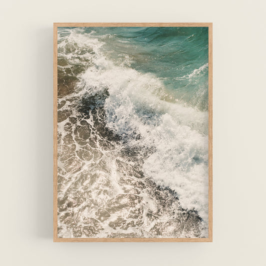 a picture of a wave crashing on the beach