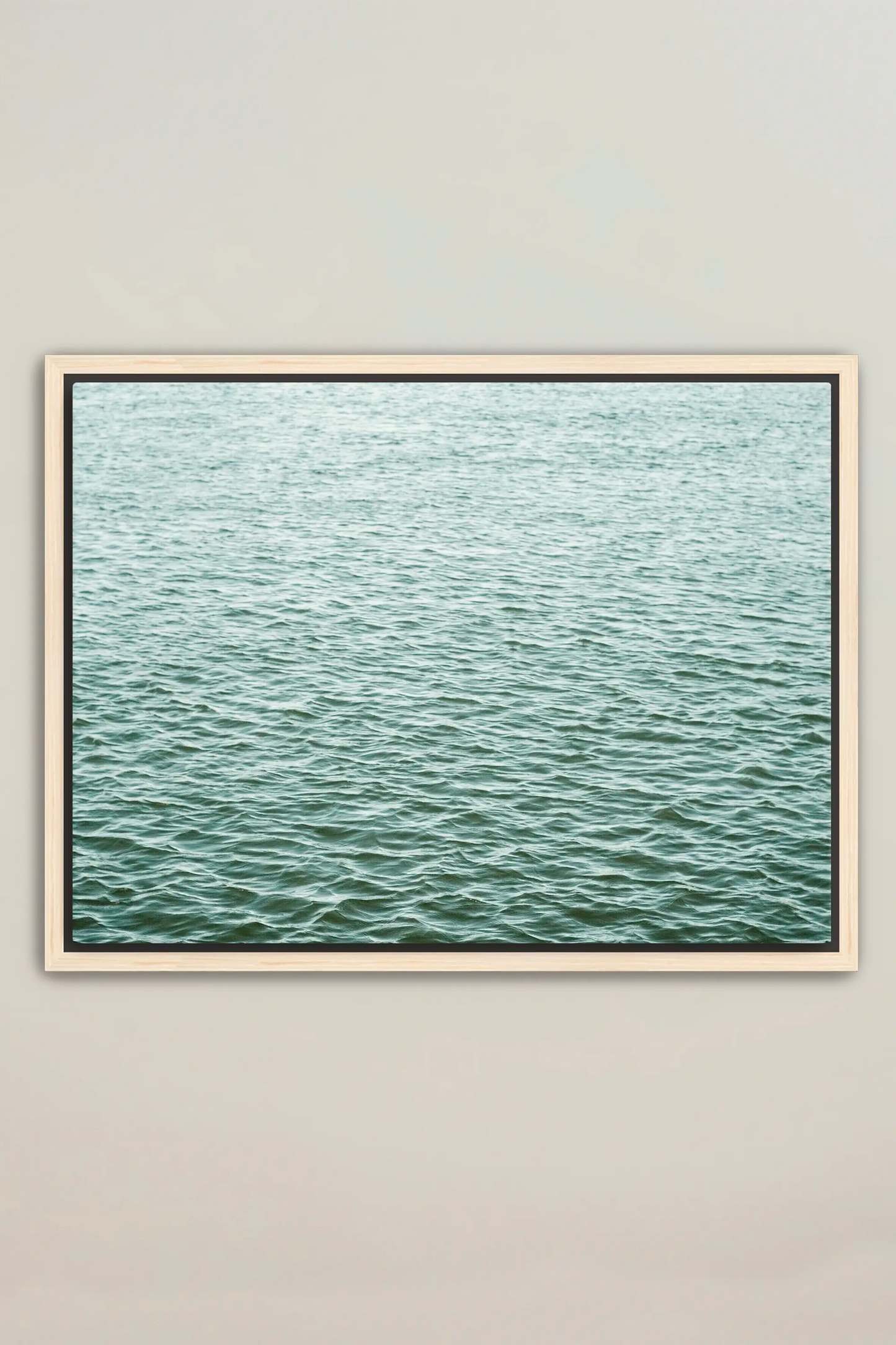 a picture of a body of water in a frame